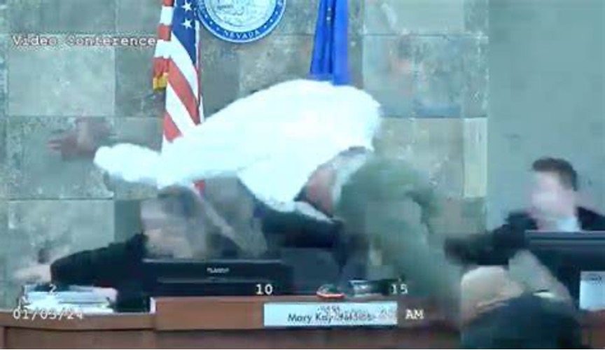 Image of man jumping onto judge in courtroom
