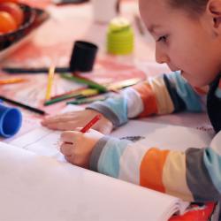 girl coloring on paper